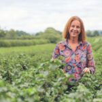 Fourth generation blackcurrant grower Jo Hilditch in a blackcurrant field.