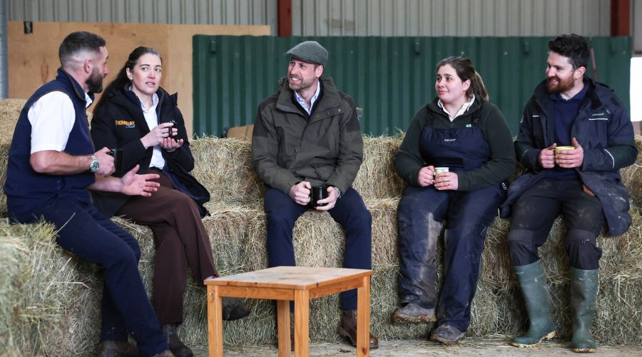 Prince William visited an orchard in Herefordshire, trying his hand at pruning apple trees while speaking with farmers about mental health.